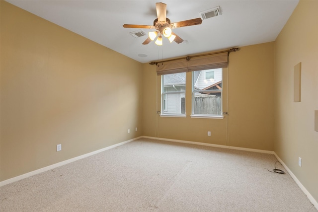 empty room with ceiling fan and carpet flooring