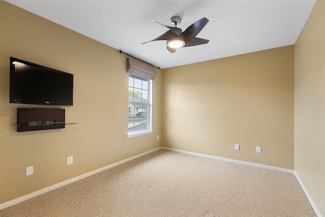 carpeted empty room with ceiling fan