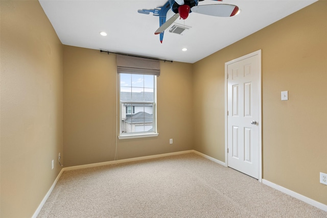 carpeted empty room with ceiling fan