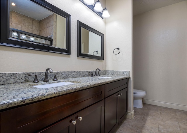 bathroom with vanity, toilet, and walk in shower