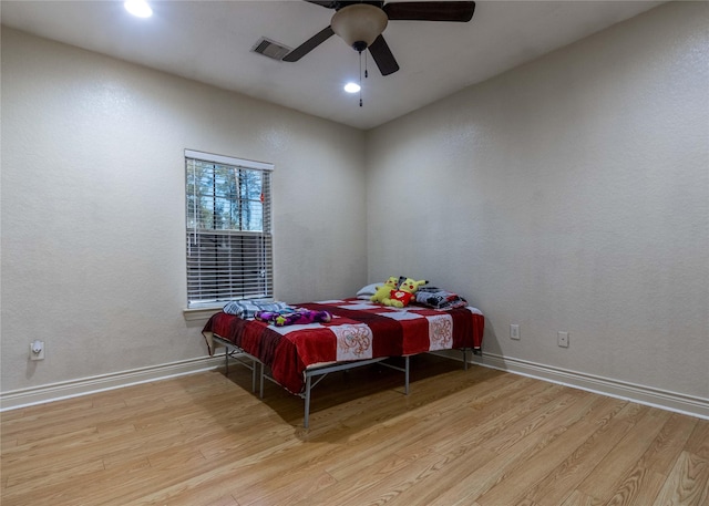 bedroom featuring ceiling fan and light hardwood / wood-style floors