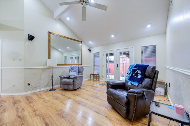 living area featuring french doors, ceiling fan, lofted ceiling, and light hardwood / wood-style floors