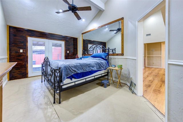 bedroom featuring lofted ceiling with beams, ceiling fan, and wood walls