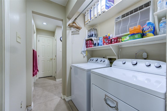 laundry area with independent washer and dryer