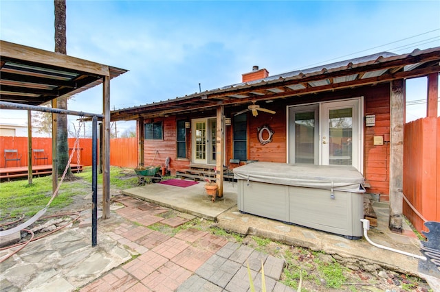 view of patio / terrace with a hot tub