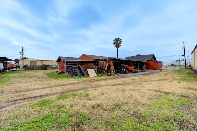 view of outbuilding featuring a lawn