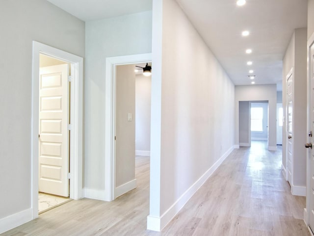 corridor featuring light hardwood / wood-style floors