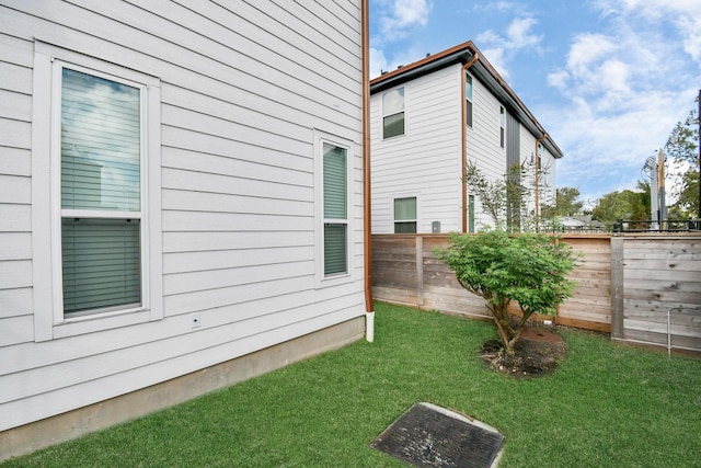 view of home's exterior featuring a yard