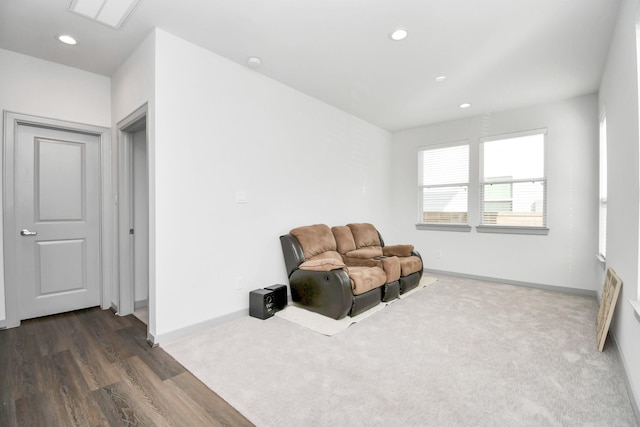 sitting room with dark hardwood / wood-style floors