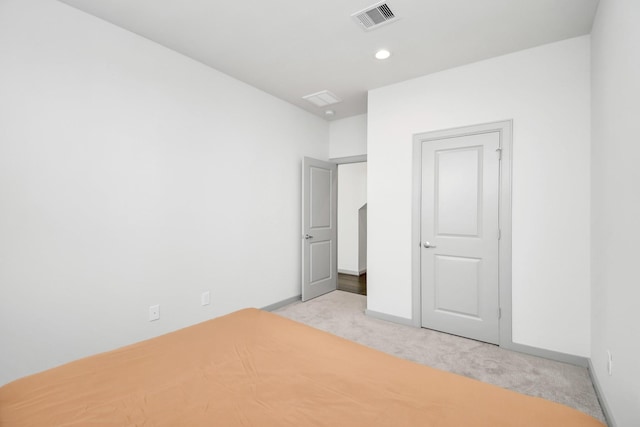 unfurnished bedroom with light carpet