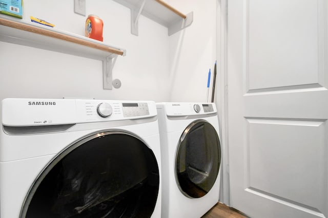 laundry area featuring hardwood / wood-style floors and washer and dryer