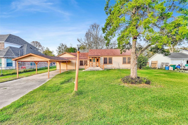 ranch-style house with a carport and a front lawn