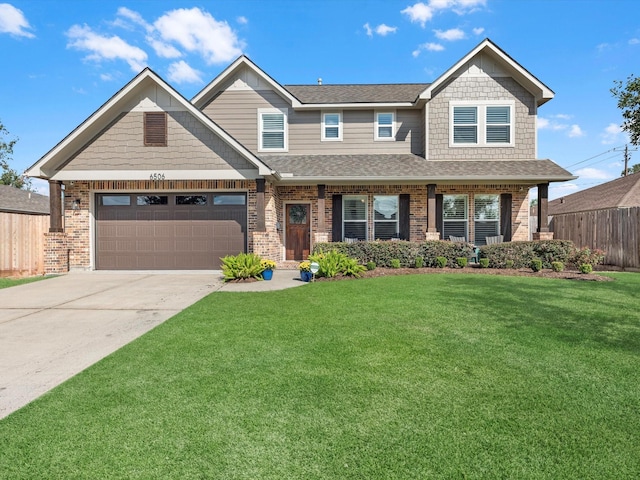 craftsman-style home featuring a garage and a front yard