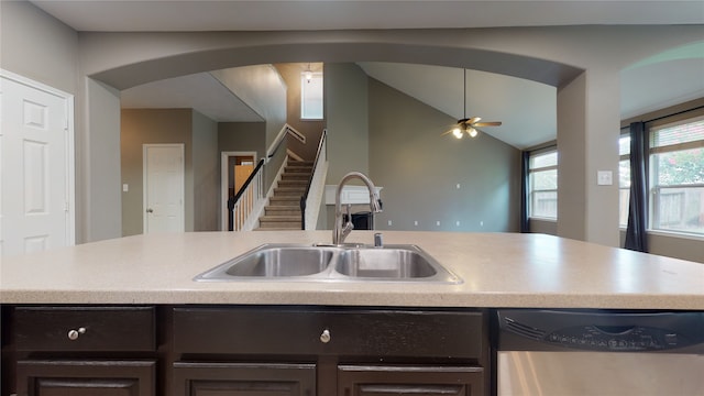 kitchen featuring ceiling fan, dishwasher, vaulted ceiling, and sink