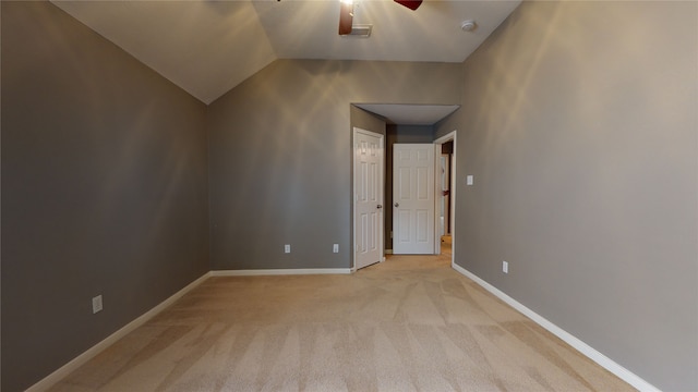 additional living space with light carpet, ceiling fan, and lofted ceiling