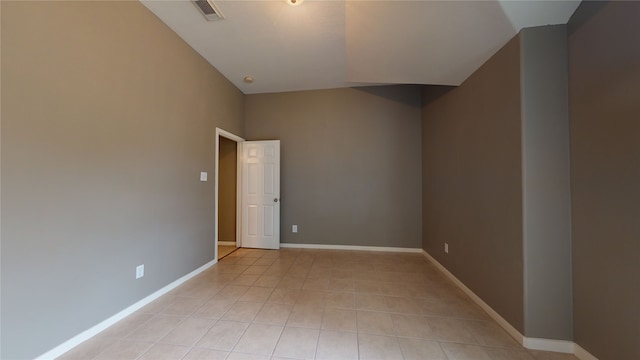 unfurnished room featuring light tile patterned floors