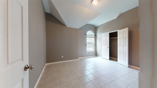 unfurnished bedroom featuring a closet and light tile patterned floors