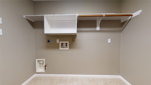 laundry room with hookup for an electric dryer, gas dryer hookup, light tile patterned floors, and washer hookup