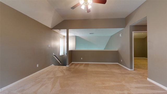 unfurnished room with light carpet, ceiling fan, and lofted ceiling