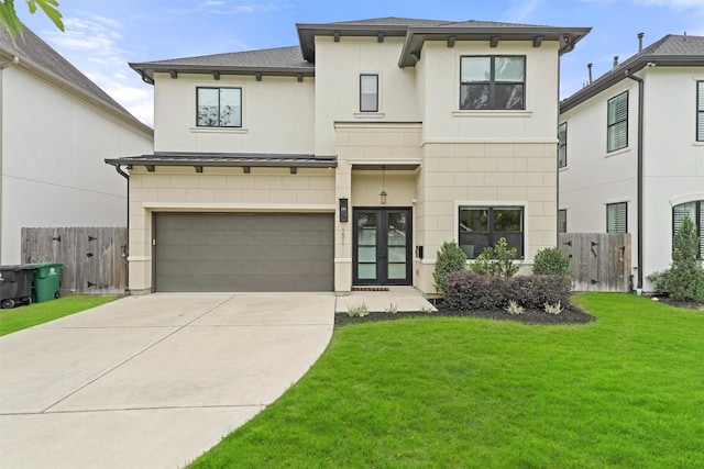 view of front of home featuring a garage and a front yard