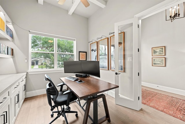 office space featuring ceiling fan with notable chandelier, beam ceiling, and light wood-type flooring