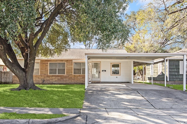 single story home featuring a front yard and a carport