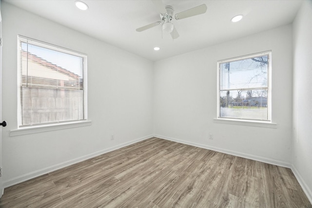 unfurnished room featuring light hardwood / wood-style floors and ceiling fan