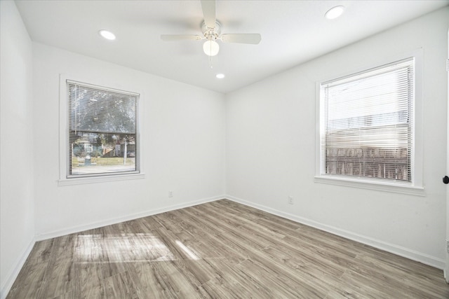 empty room featuring ceiling fan and light wood-type flooring