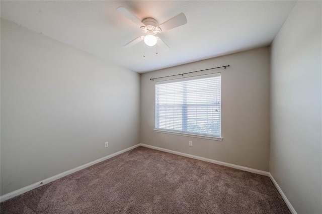 spare room with ceiling fan and carpet floors