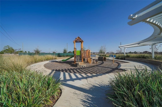 view of playground featuring a pergola