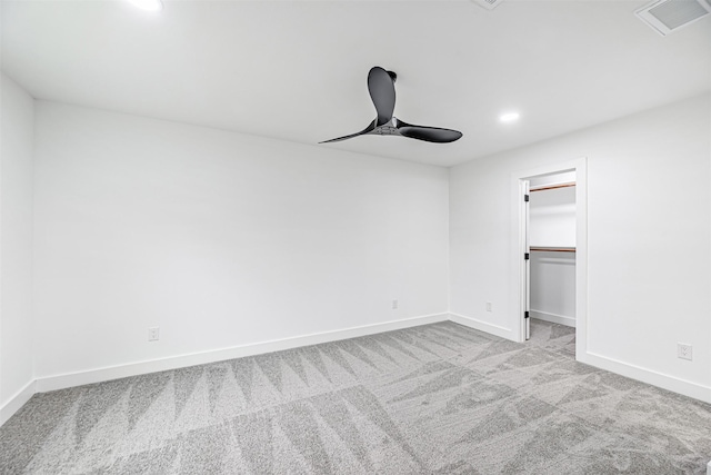 spare room with light carpet and ceiling fan