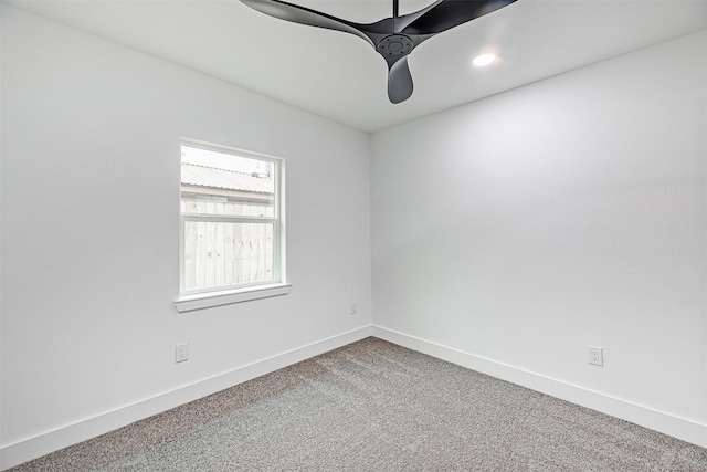 empty room featuring ceiling fan and carpet flooring