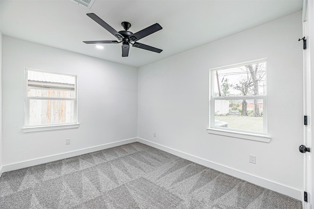 unfurnished room with ceiling fan and carpet flooring