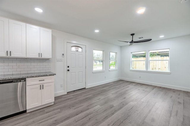 kitchen featuring tasteful backsplash, white cabinets, ceiling fan, and dishwasher