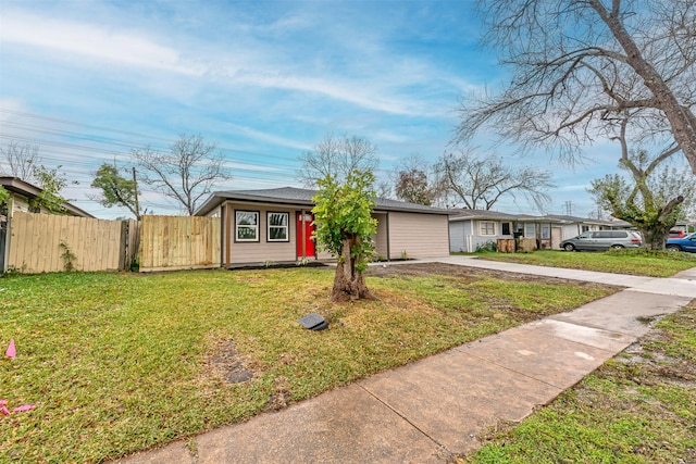 single story home with a front lawn