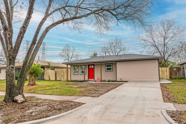 single story home featuring a front lawn