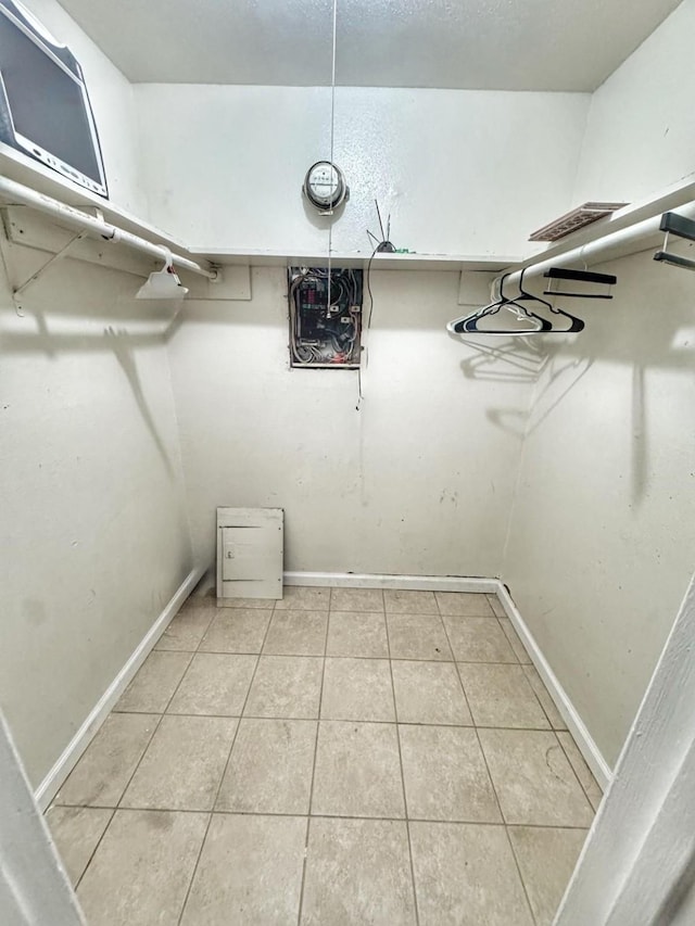 spacious closet featuring tile patterned flooring