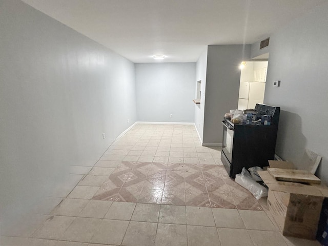 unfurnished room with light tile patterned floors