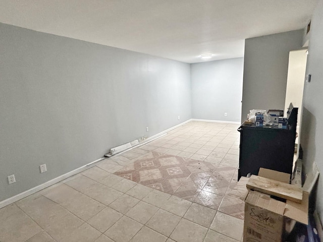 unfurnished room with light tile patterned floors