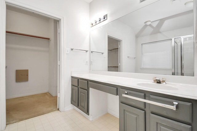 bathroom featuring vanity and walk in shower