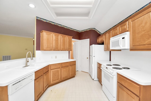 kitchen featuring kitchen peninsula, sink, white appliances, and ornamental molding