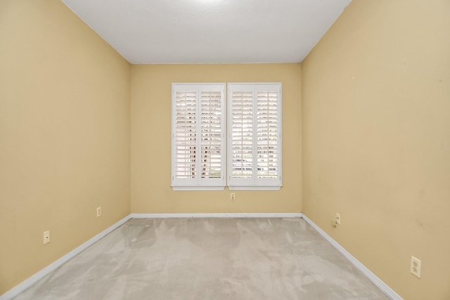 empty room featuring light colored carpet