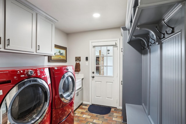 laundry area with cabinets and washer and clothes dryer