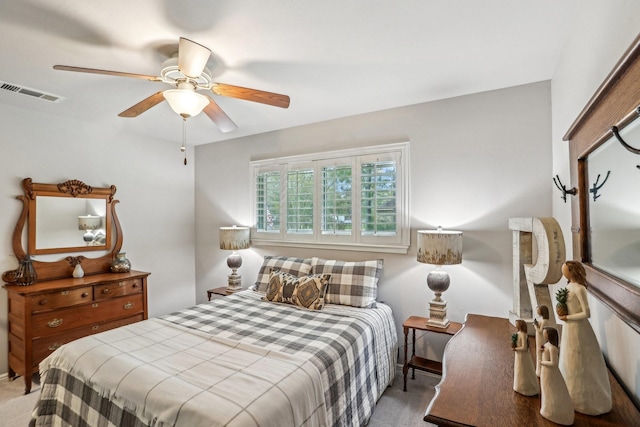 bedroom featuring ceiling fan and carpet