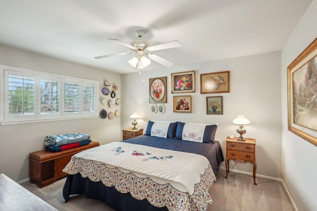 bedroom with light carpet and ceiling fan