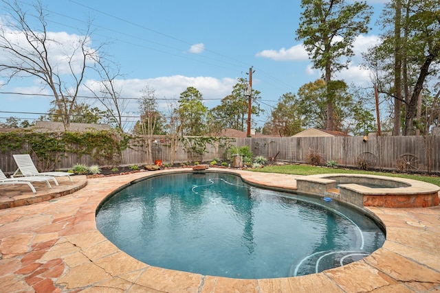 view of swimming pool with an in ground hot tub and a patio