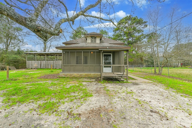 back of property featuring a sunroom