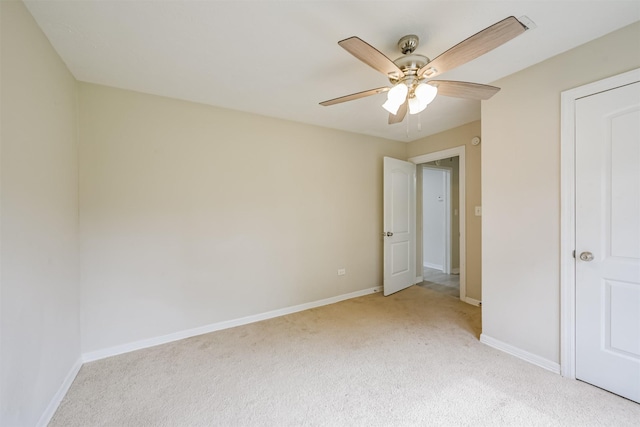 unfurnished bedroom with ceiling fan and light colored carpet