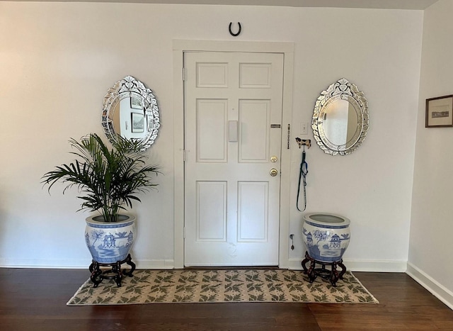 entryway with dark wood-type flooring