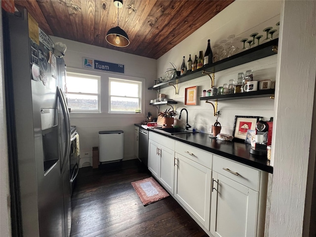 interior space with dark hardwood / wood-style floors, wet bar, wooden ceiling, and washing machine and clothes dryer